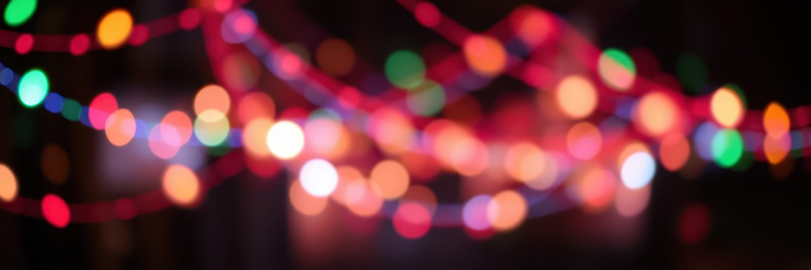 Colorful lights create a festive atmosphere in a lively celebration during the evening